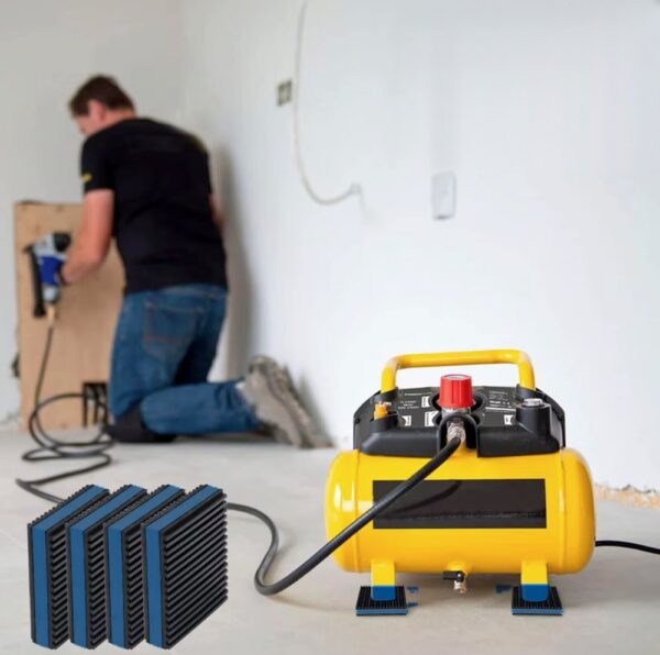 Blue EVA core anti vibration pads placed under the feet of a portable air compressor in a workshop
