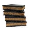 cork-rubber-anti-vibration-pad-layer-detail Cork rubber anti vibration pads stacked front on, with the cork core and the toothed rubber facings visible on the cut edge