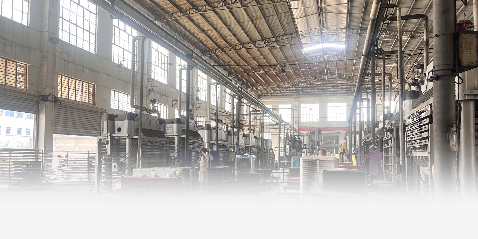Row of hydraulic foaming presses at the SANSD EVA foam factory in Jinjiang, Fujian, China