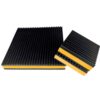 Yellow EVA core anti vibration pad standing on edge beside a larger pad, showing the closed cell foam core between two ribbed rubber layers