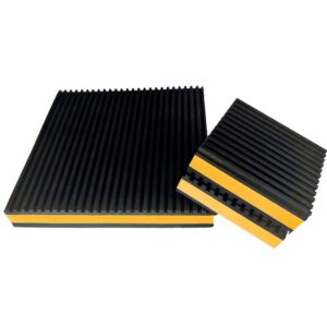 Yellow EVA core anti vibration pad standing on edge beside a larger pad, showing the closed cell foam core between two ribbed rubber layers