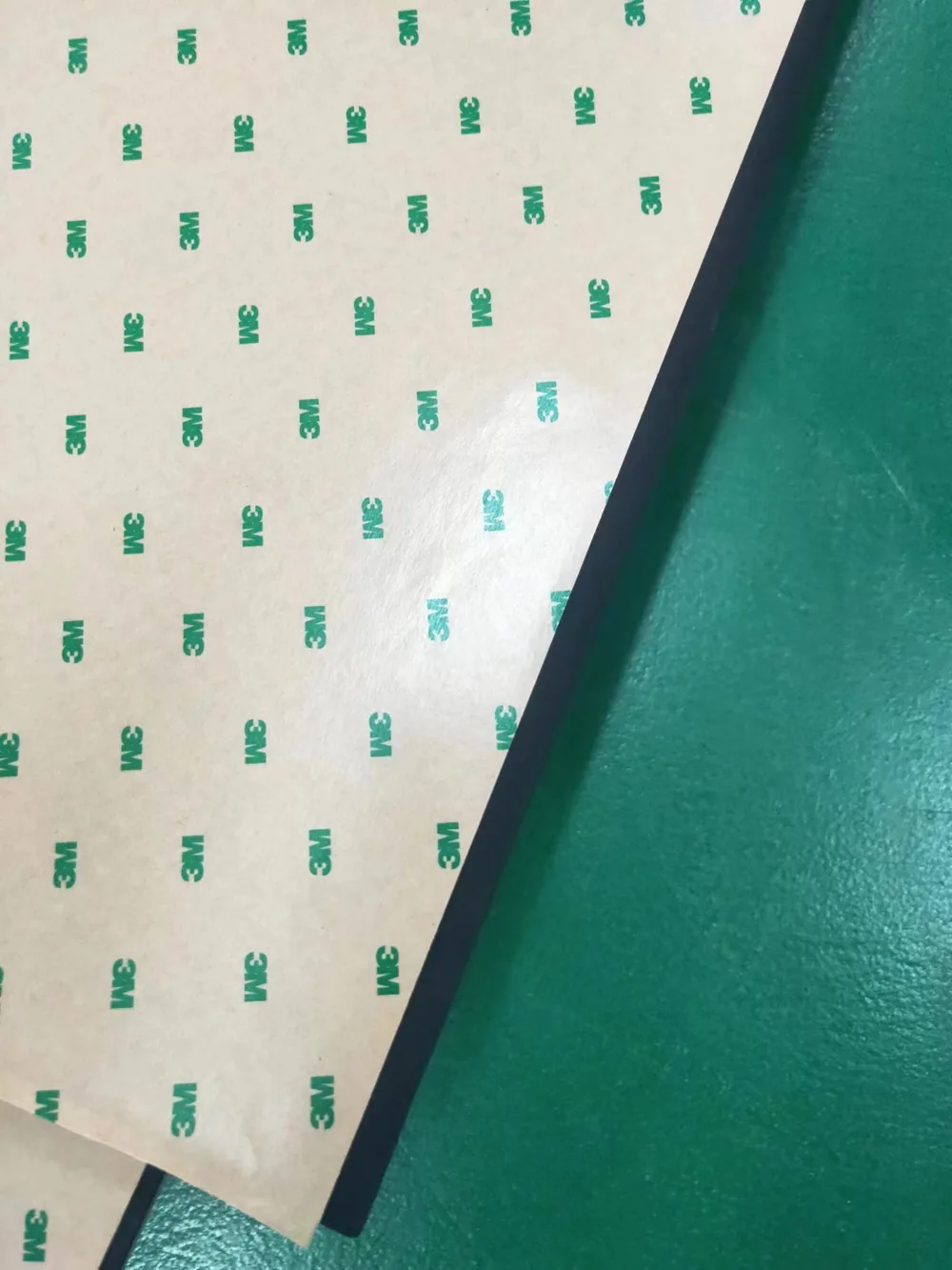 Black EVA foam sheet with 3M adhesive backing and printed 3M release liner