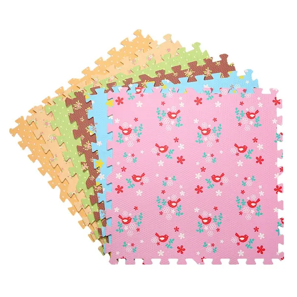 Stack of EVA puzzle mat tiles with a printed pink floral pattern