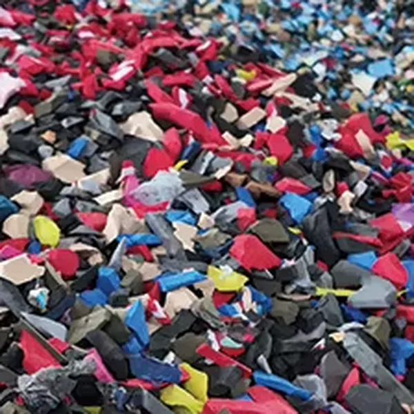 Shredded multicolor EVA foam scrap collected for rebonded artificial turf shock pad