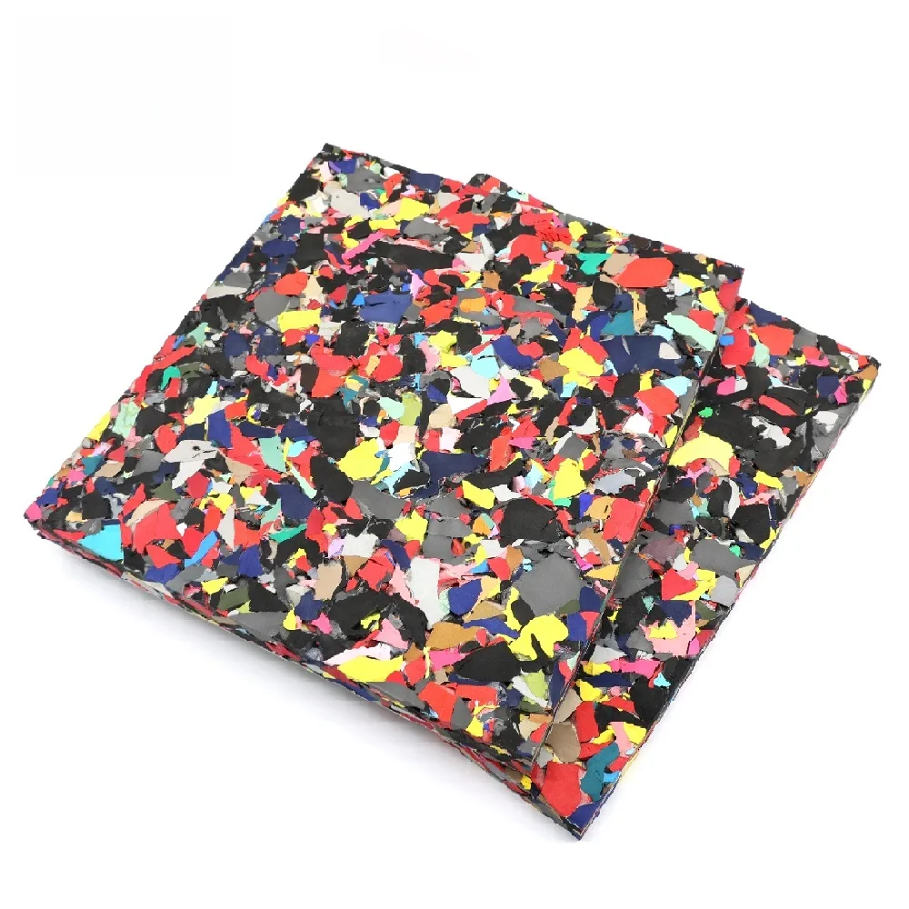 Two multicolor rebonded EVA foam shock pad sheets for synthetic turf, showing shredded EVA chips bonded together